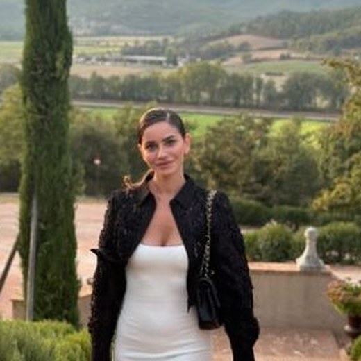 Giordana, founder of Porch Studio Naples, photographed on a hillside terrace in Italy at sunset.